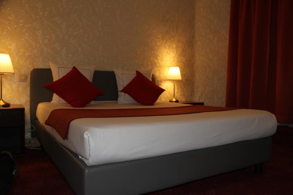 Postel nebo postele na pokoji v ubytování Hotel De Spiegel