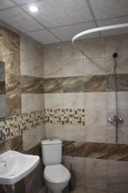 Koupelna v ubytování Daskalov Bungalows