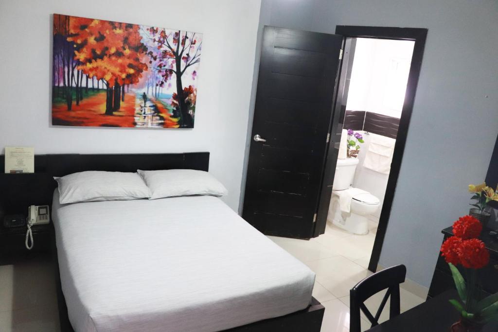 Postel nebo postele na pokoji v ubytování Hotel Merey