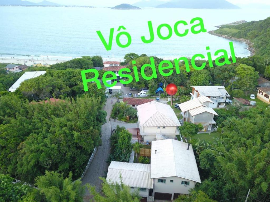a sign that reads vs joca residential in front of a house at Residencial Vô Joca in Palhoça