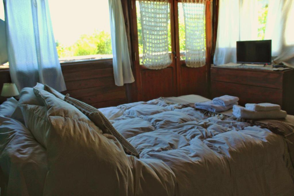 Voodi või voodid majutusasutuse Criollo Lodge toas