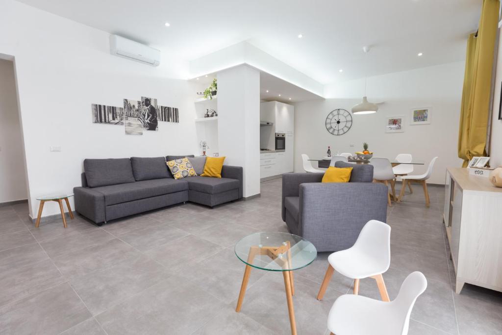 a living room with a couch and a table at La casa di Bicio in La Spezia