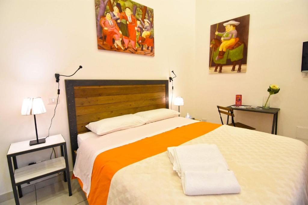 Postel nebo postele na pokoji v ubytování B&B Ninarella Napoli