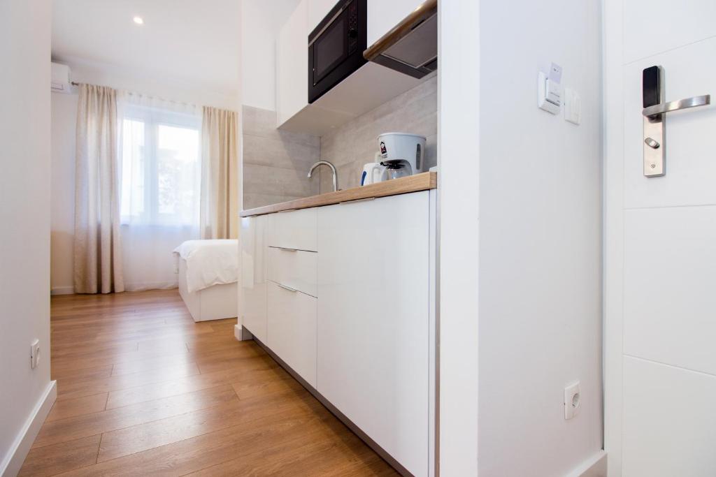 Kuchyňa alebo kuchynka v ubytovaní Lugo Apartments