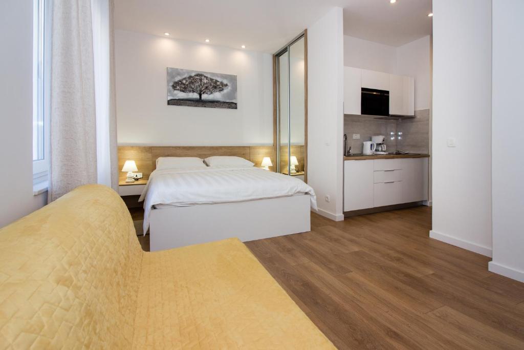 Posteľ alebo postele v izbe v ubytovaní Lugo Apartments