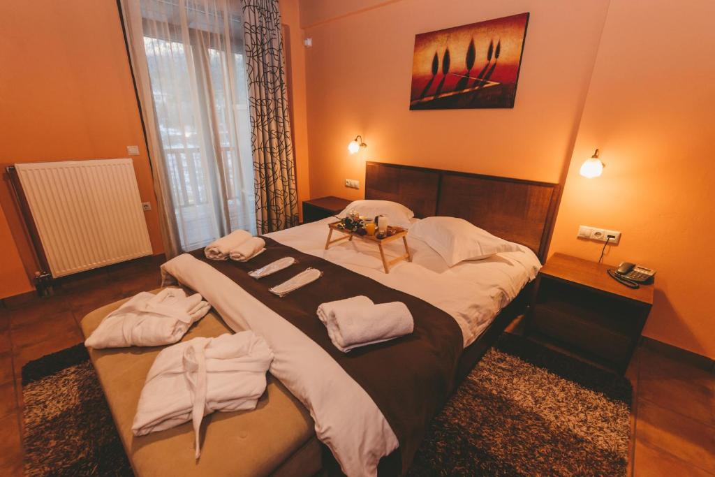 Postel nebo postele na pokoji v ubytování Thea Mainalou