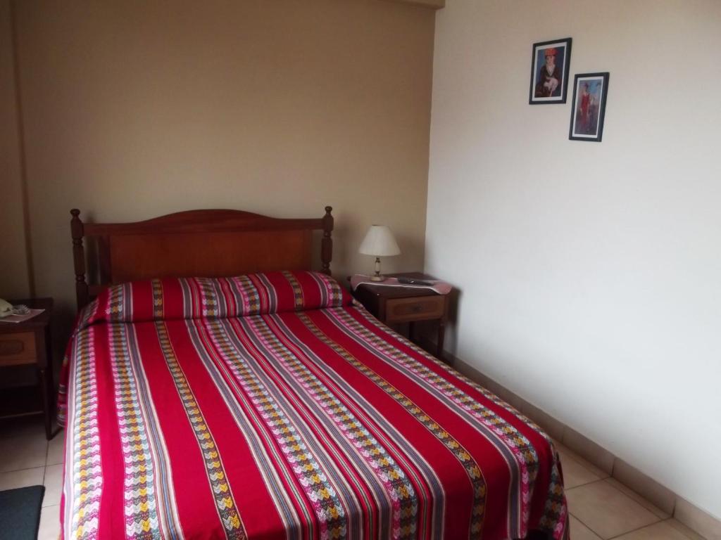 Postel nebo postele na pokoji v ubytování Hostal Gemina