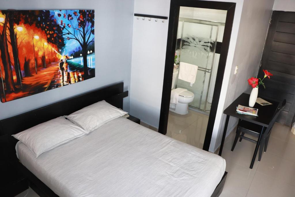 Postel nebo postele na pokoji v ubytování Hotel Merey