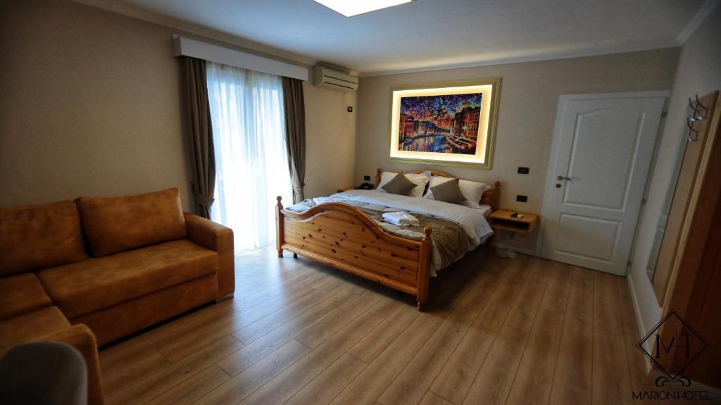 Postel nebo postele na pokoji v ubytování MARION HOTEL