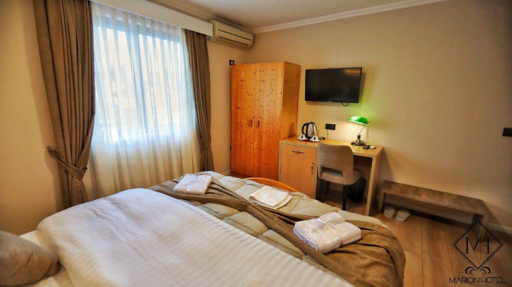 Postel nebo postele na pokoji v ubytování MARION HOTEL