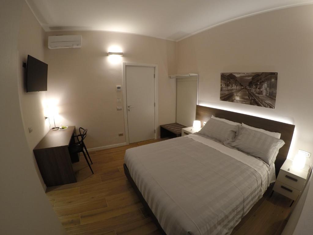 Postel nebo postele na pokoji v ubytování 2 Navigli