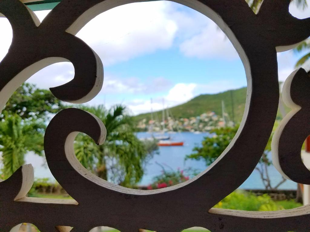 a view of a harbor through a metal fence at Gingerbread Suites in Port Elizabeth