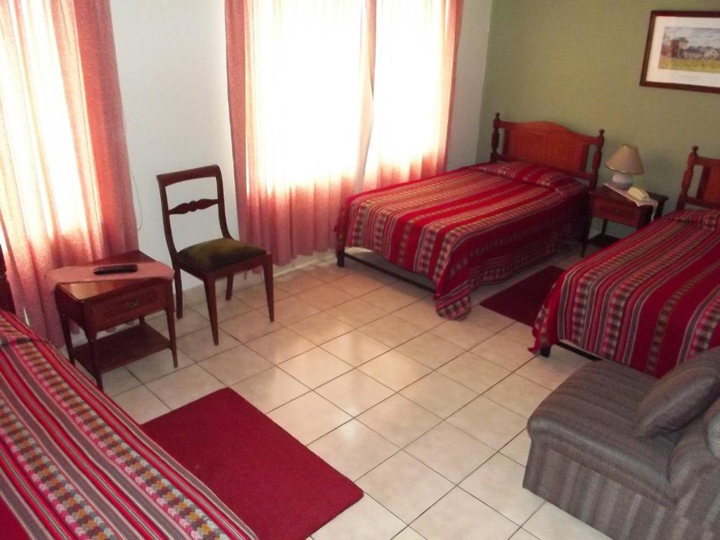 Postel nebo postele na pokoji v ubytování Hostal Gemina