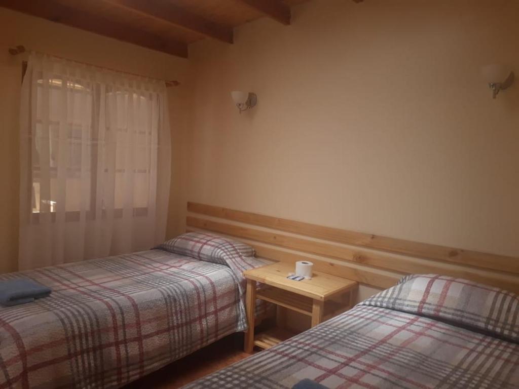 Postel nebo postele na pokoji v ubytování CASA MACAW