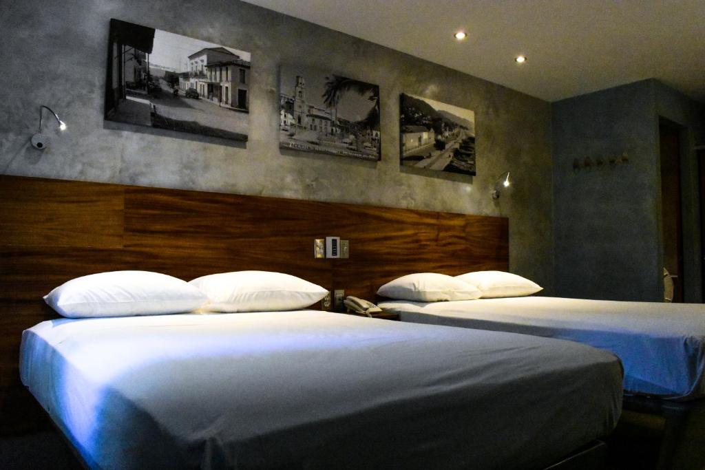 Postel nebo postele na pokoji v ubytování Hotel Rio Malecon