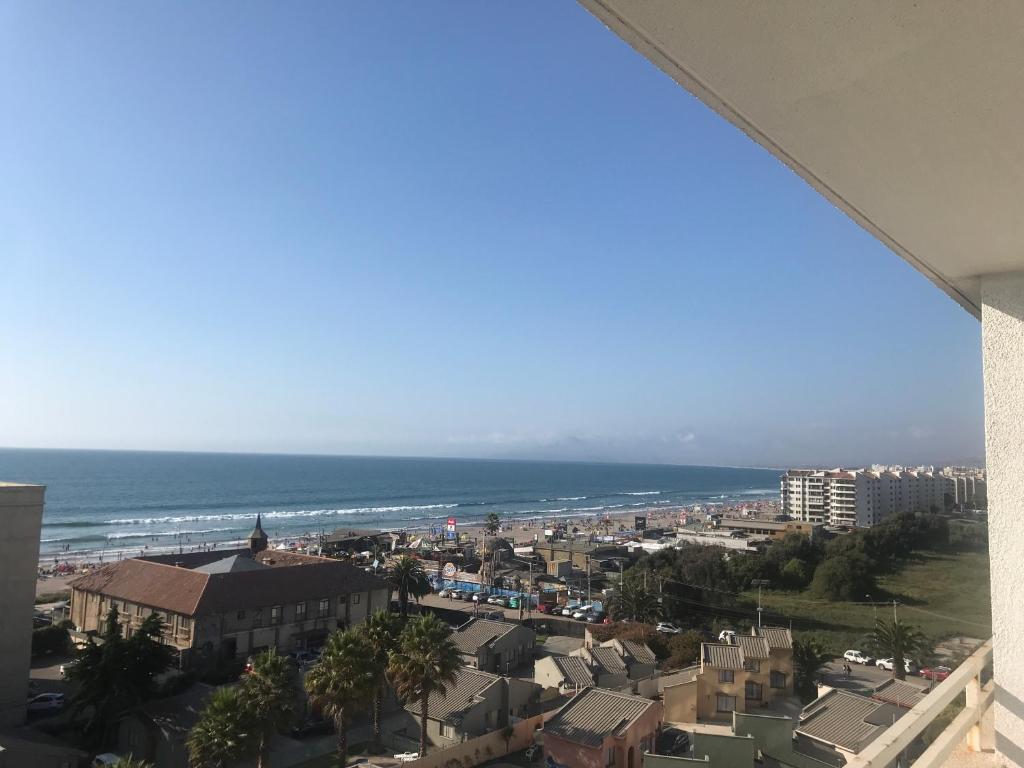 a view of a city and the ocean from a building at Departamento Edificio Terrazas de Sol in La Serena