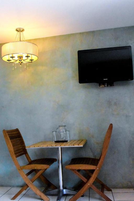 TV a/nebo společenská místnost v ubytování Hotel Rio Malecon
