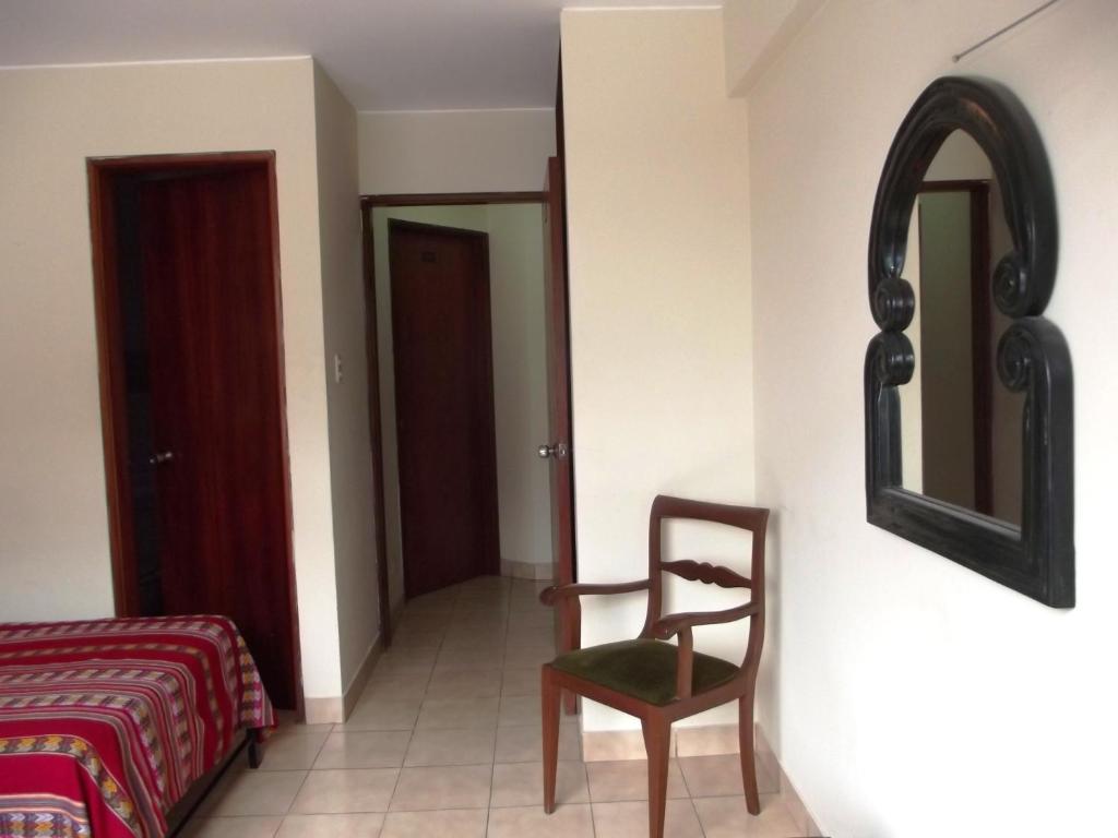 Postel nebo postele na pokoji v ubytování Hostal Gemina