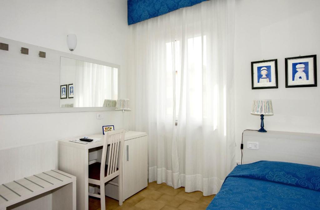 Posteľ alebo postele v izbe v ubytovaní Hotel Lucerna
