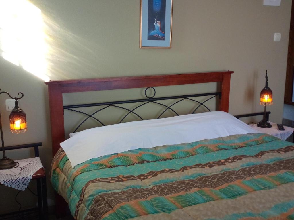 Postel nebo postele na pokoji v ubytování Guesthouse Kalosorisma