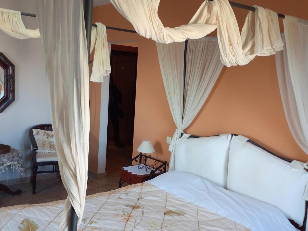 Postel nebo postele na pokoji v ubytování Guesthouse Kalosorisma