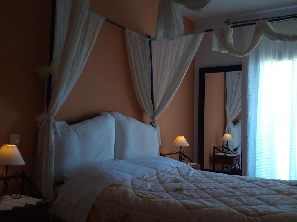 Postel nebo postele na pokoji v ubytování Guesthouse Kalosorisma