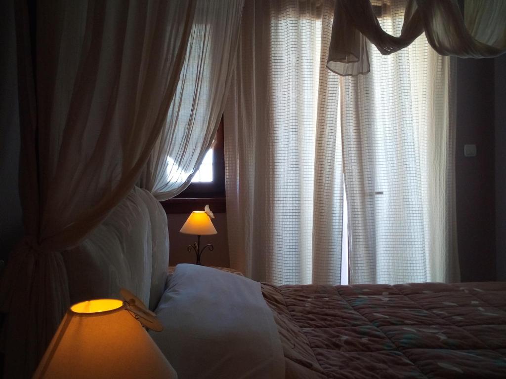 Postel nebo postele na pokoji v ubytování Guesthouse Kalosorisma