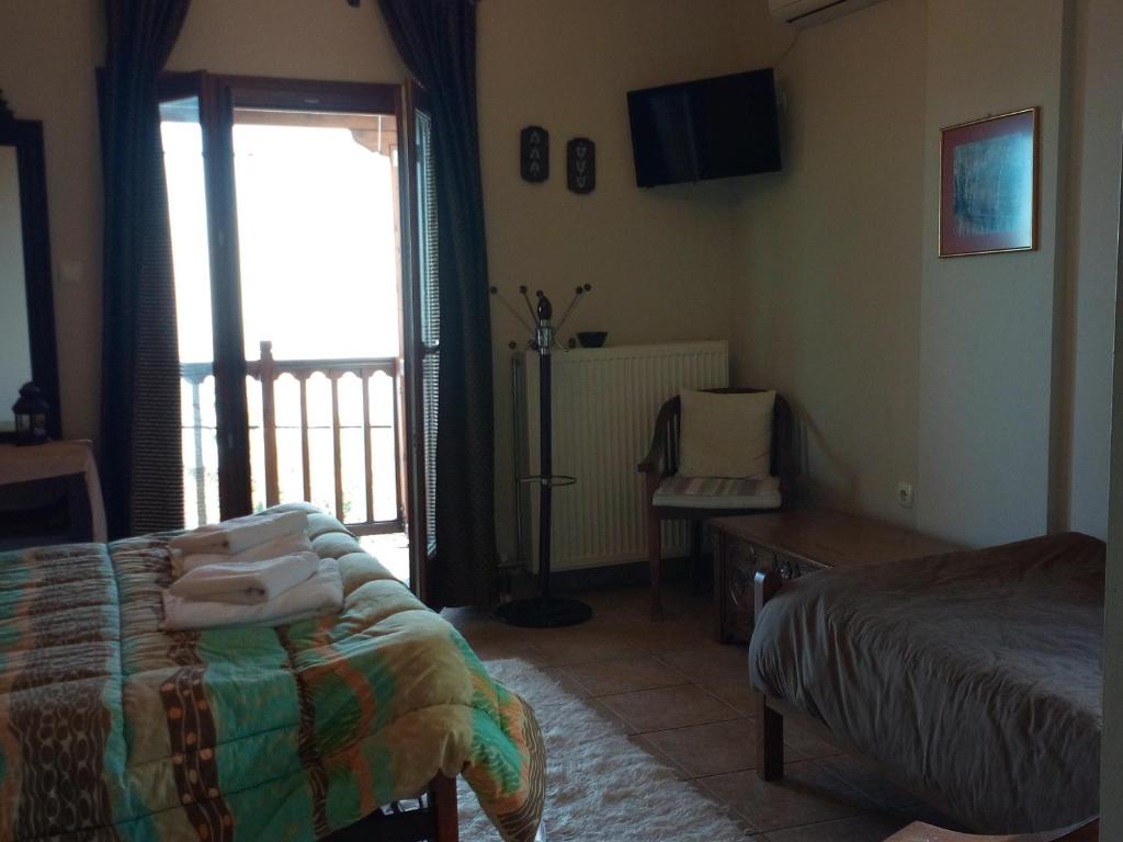 Postel nebo postele na pokoji v ubytování Guesthouse Kalosorisma