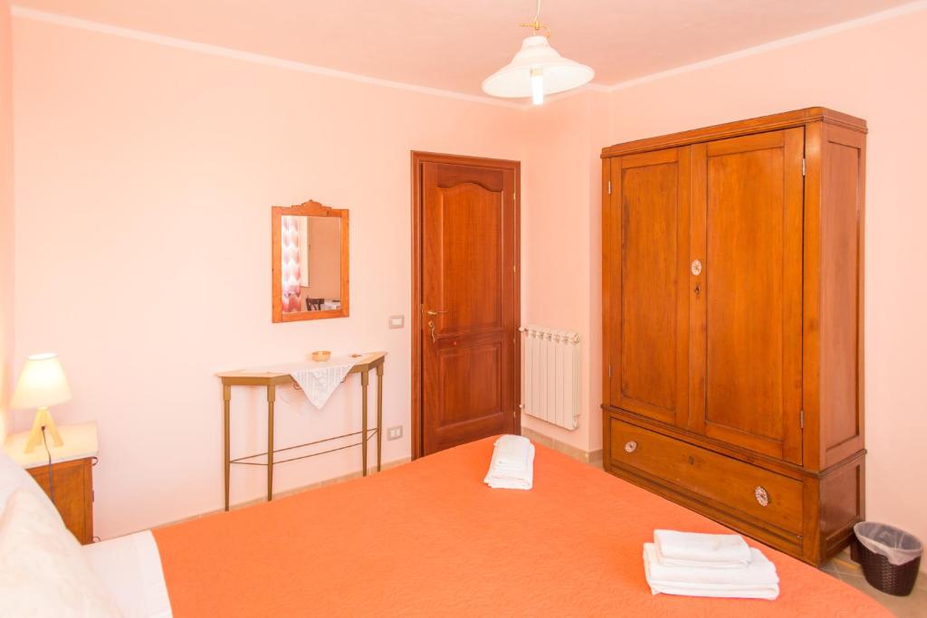 Postel nebo postele na pokoji v ubytování Le Terrazze di Pirandello