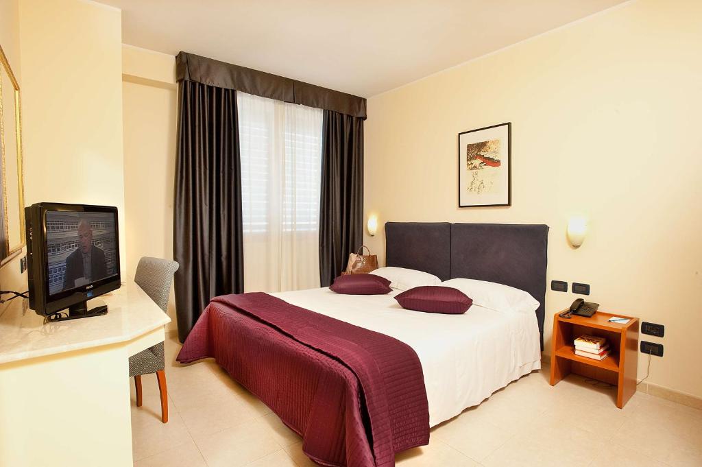 TV a/nebo společenská místnost v ubytování Best Western Blu Hotel Roma
