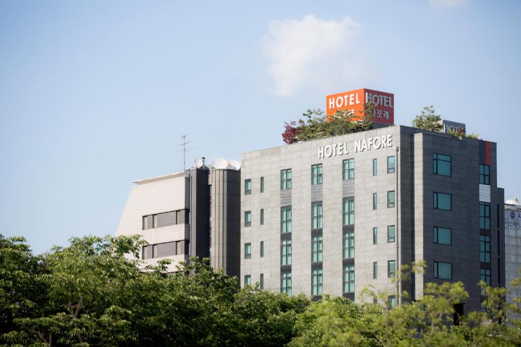 a building with a plant on the top of it at Hotel Nafore in Seoul