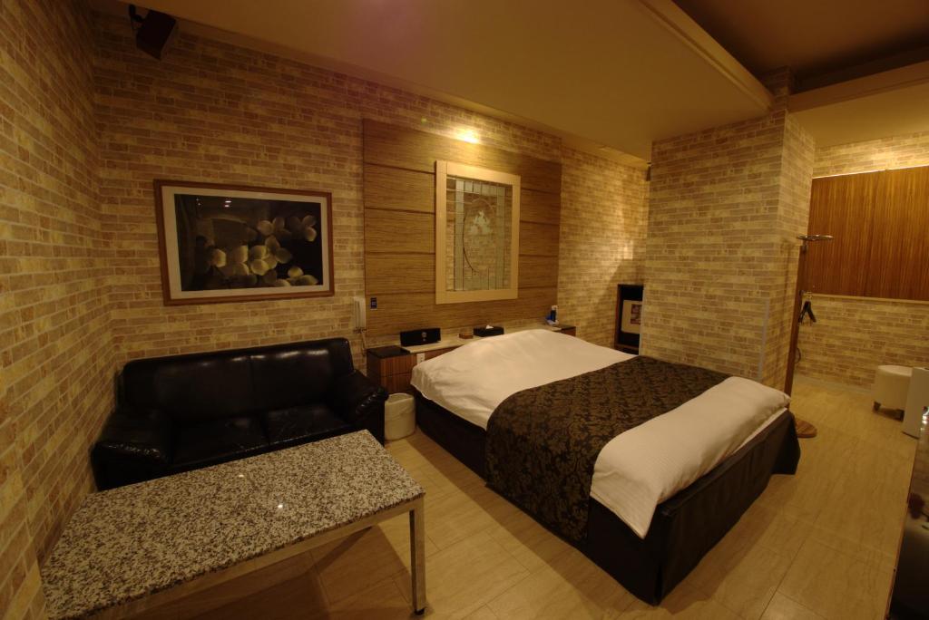 Postel nebo postele na pokoji v ubytování Hotel Allure (Adult Only)