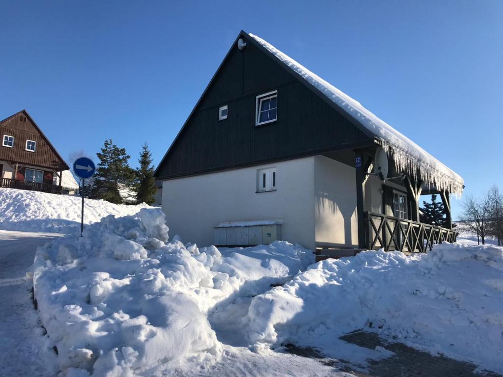 a house with a lot of snow around it at vila krkonoše in Černý Dŭl