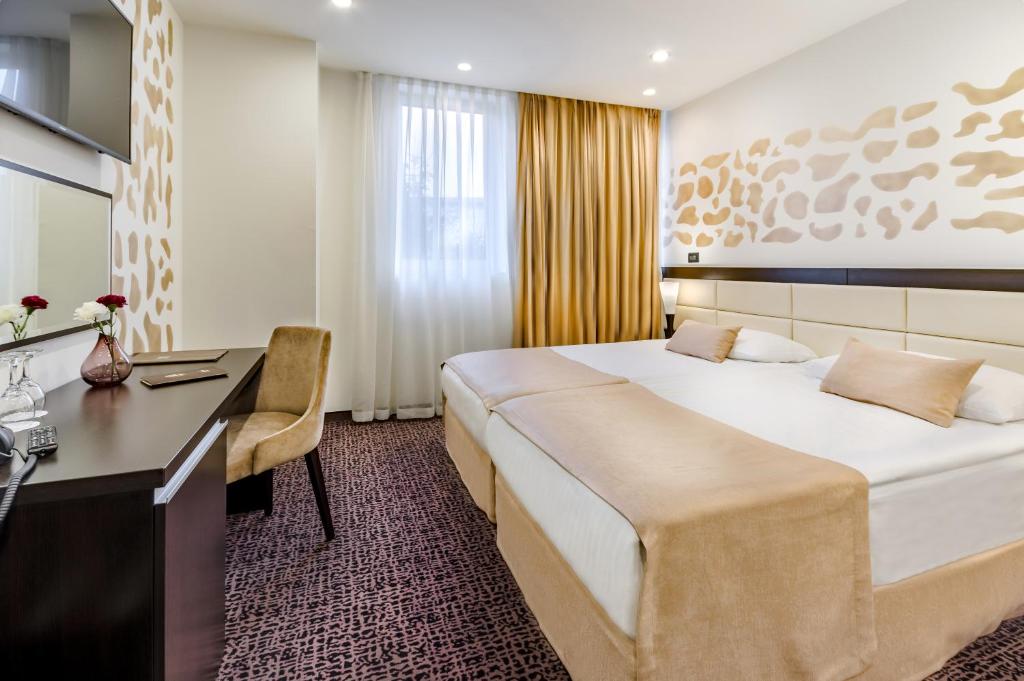 Posteľ alebo postele v izbe v ubytovaní Hotel Diplomat