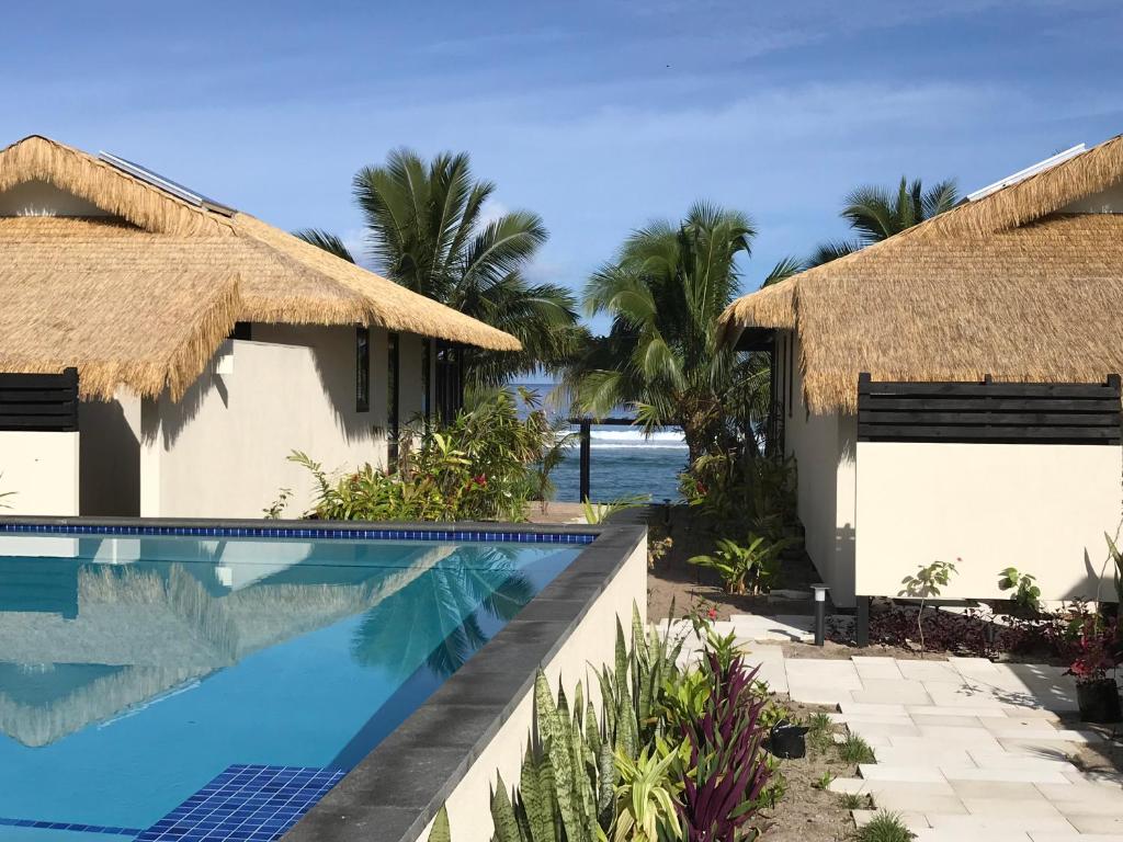a view of a resort with a swimming pool at Serenity Villas Rarotonga in Rarotonga