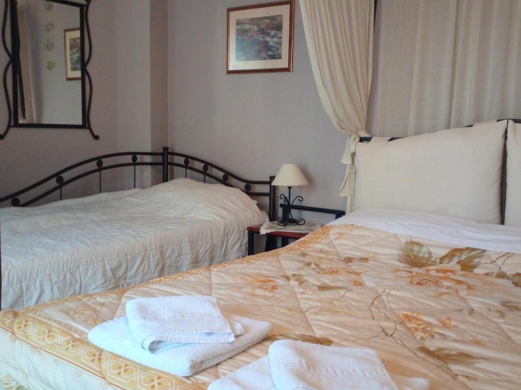 Postel nebo postele na pokoji v ubytování Guesthouse Kalosorisma