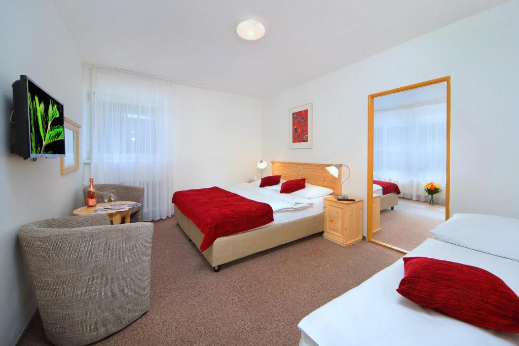 Postel nebo postele na pokoji v ubytování Hotel Lenka