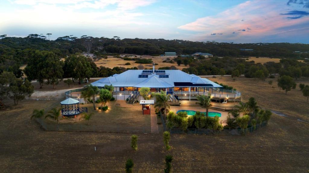 an aerial view of a house with a large tent at Doyles on the Bay in Kingscote