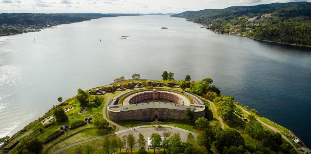 an island in the middle of a body of water at Oscarsborg Castle Hotel & Resort in Drøbak