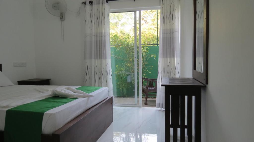 Postel nebo postele na pokoji v ubytování Senomaal Sigiri Resort