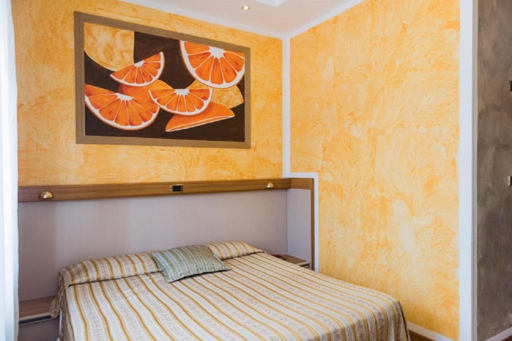 Postel nebo postele na pokoji v ubytování Hotel Royal