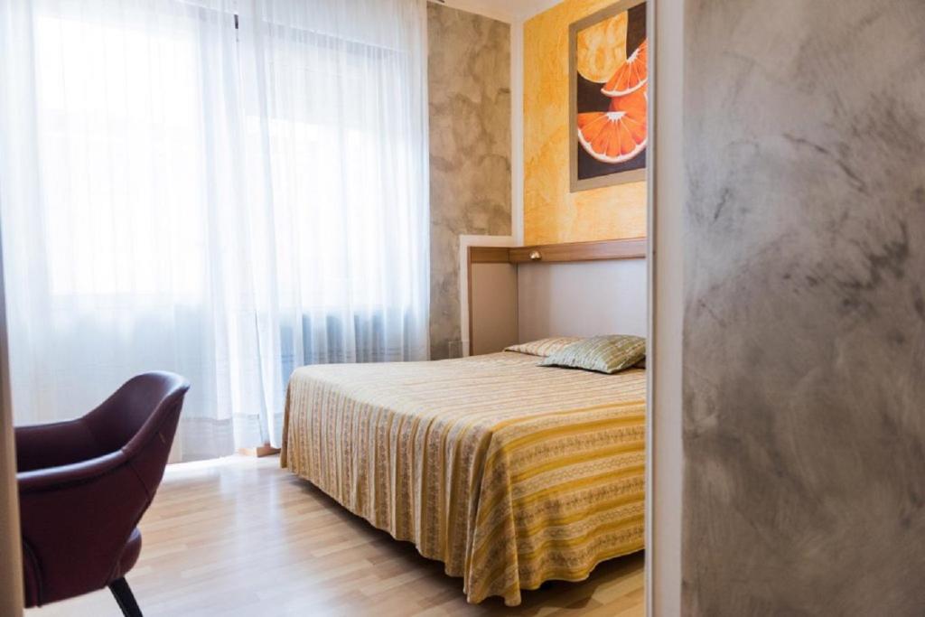 Postel nebo postele na pokoji v ubytování Hotel Royal