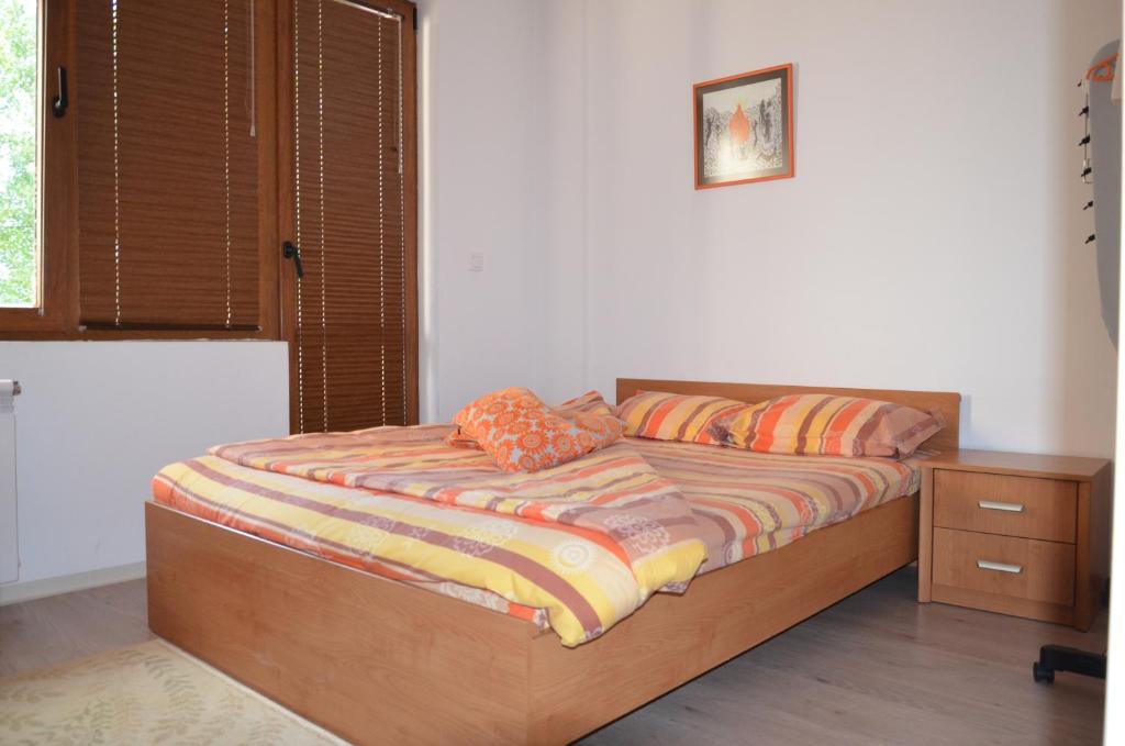 A bed or beds in a room at Bulhotel Pritzker Apartment