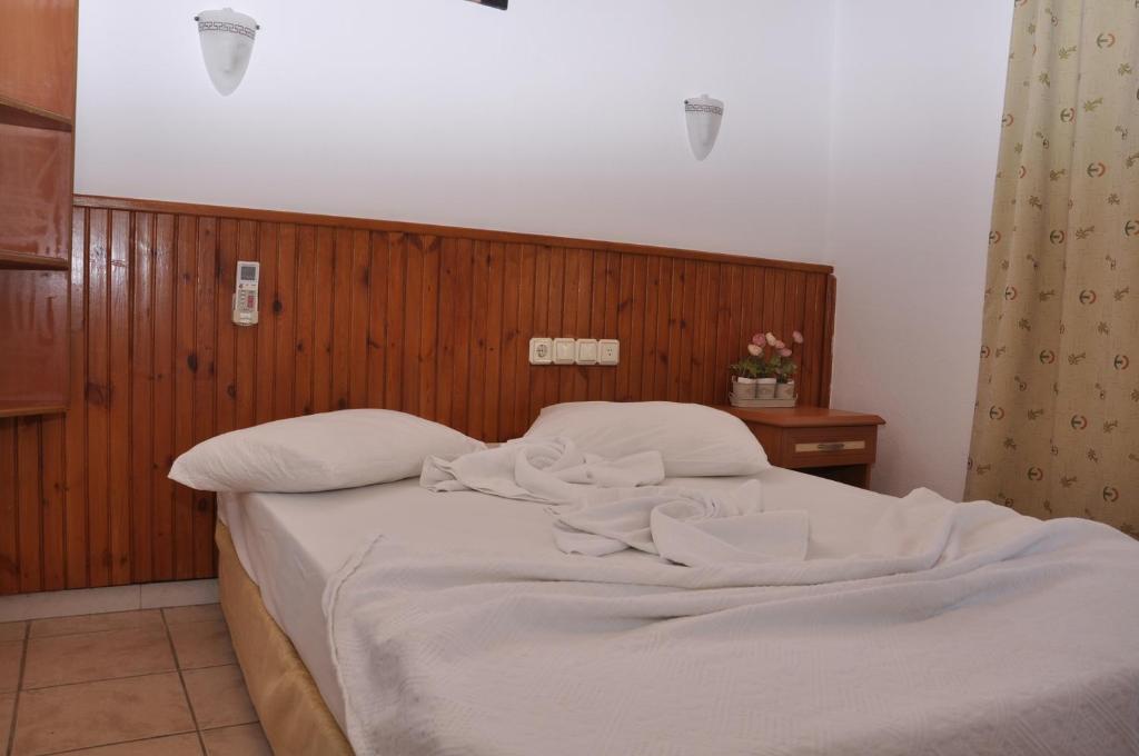 Postel nebo postele na pokoji v ubytování Latino Hotel