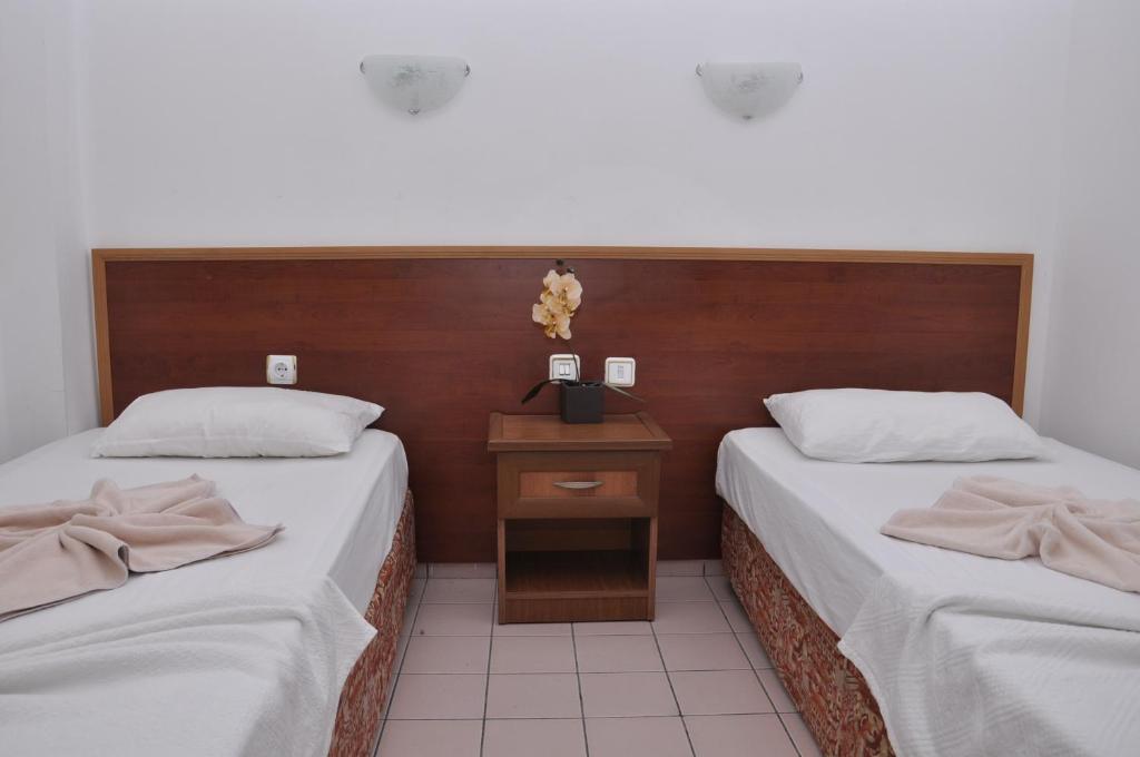 Postel nebo postele na pokoji v ubytování Latino Hotel