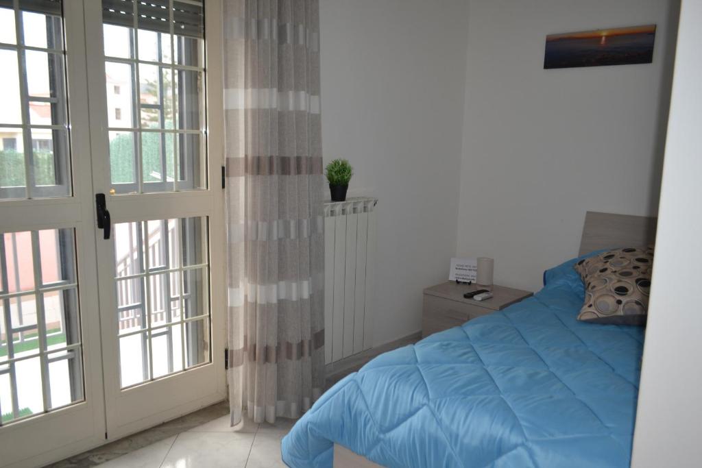 Postel nebo postele na pokoji v ubytování B&B Casa Di Lauro