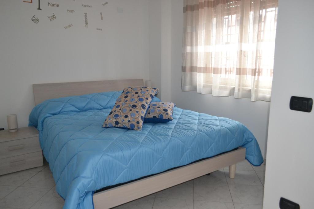 Postel nebo postele na pokoji v ubytování B&B Casa Di Lauro