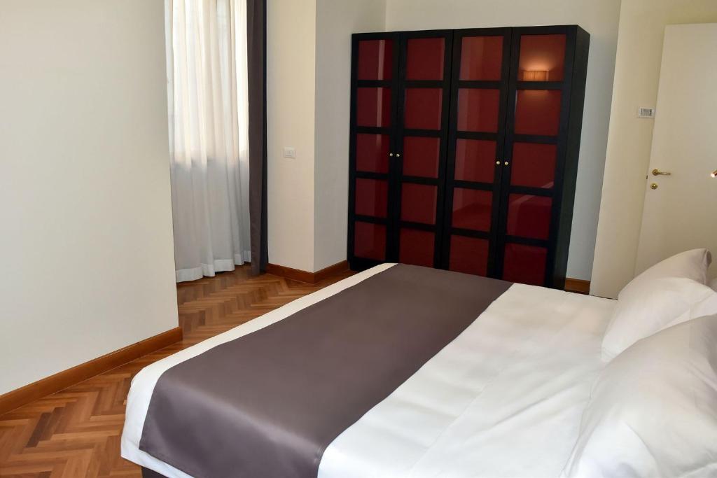 Postel nebo postele na pokoji v ubytování Torrione Hotel