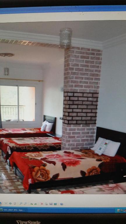 Postel nebo postele na pokoji v ubytování Auberge BAB IMOUZER