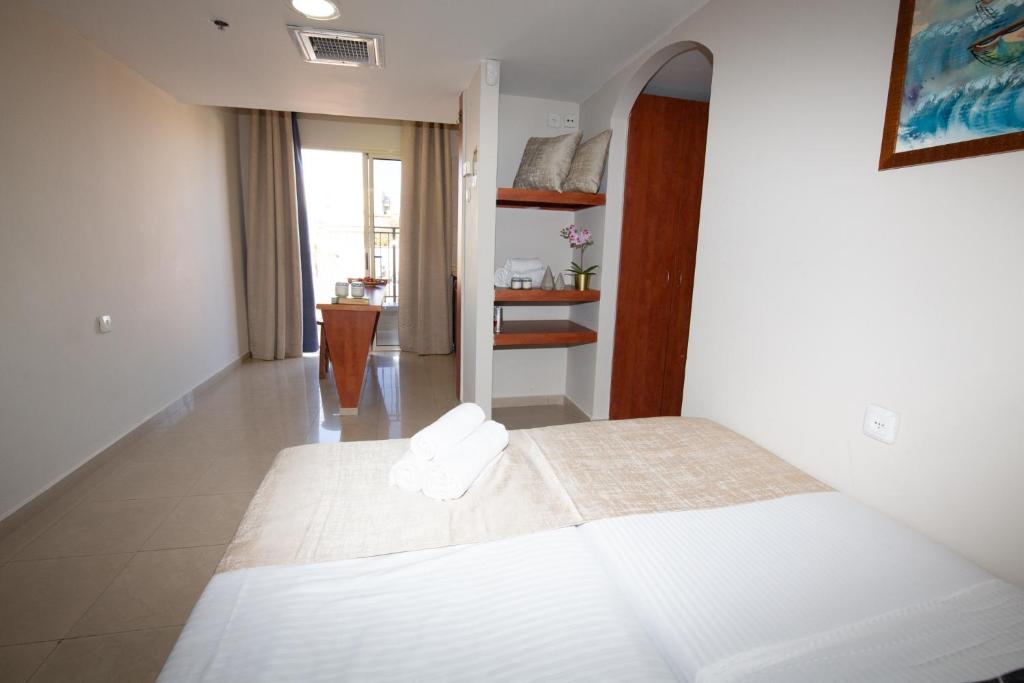 Postel nebo postele na pokoji v ubytování Motel Aviv